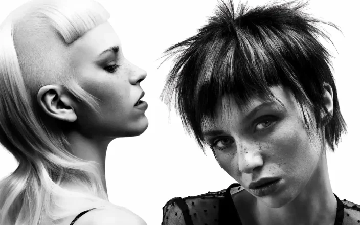 Black-and-white editorial hairstyles featuring sculpted shaved sides, textured pixie layers and bold avant-garde detailing.