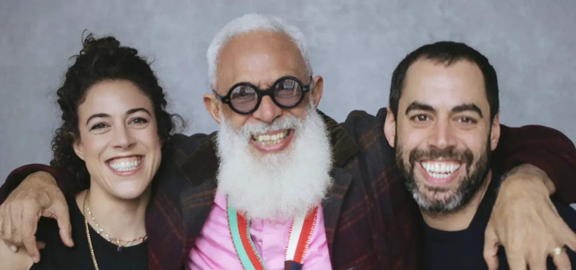 Hari Salem poses with his daughter Tassie and son Lucan in a smiling studio portrait.