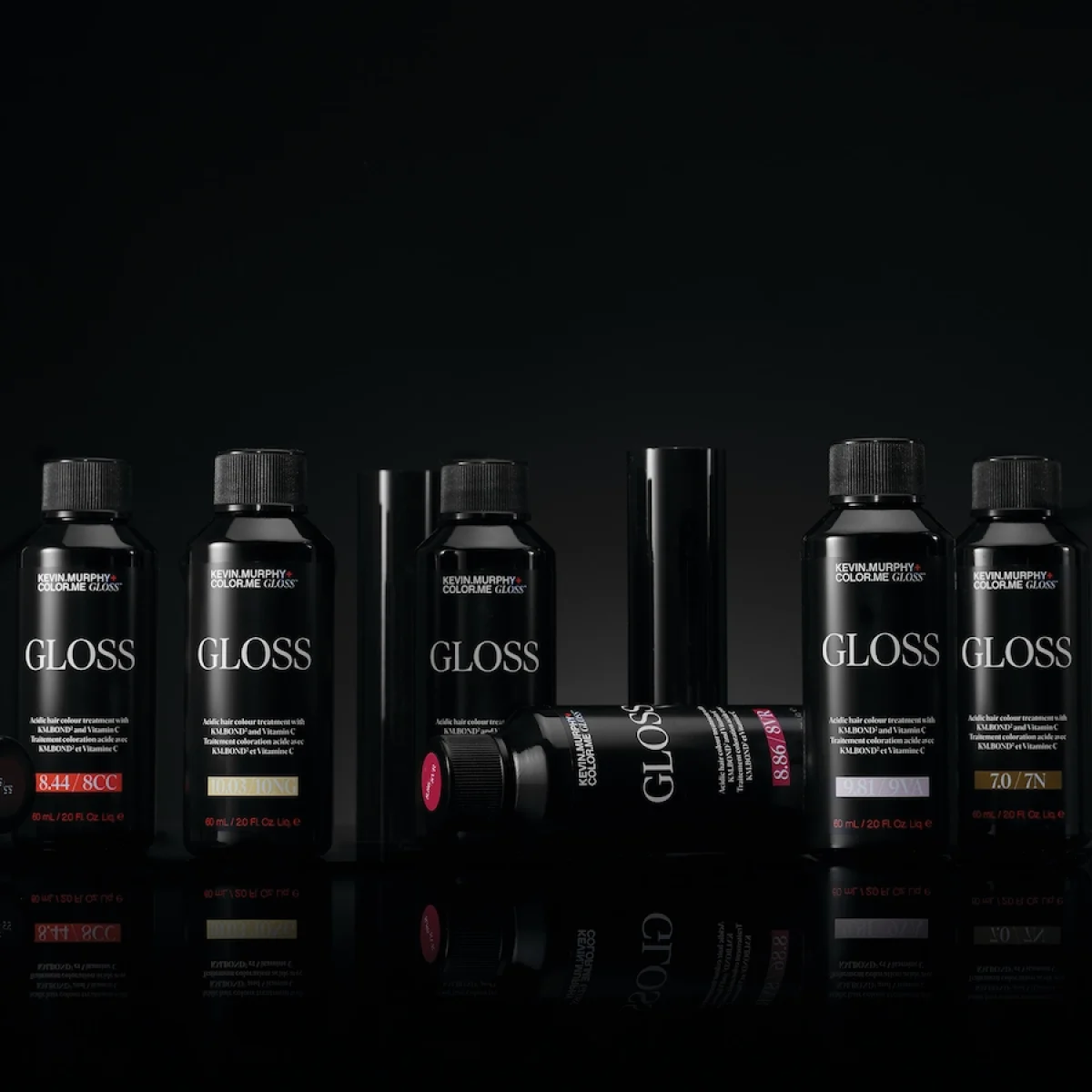 KEVIN.MURPHY+GLOSS product range displayed against a black background featuring acidic demi-permanent gloss shades.