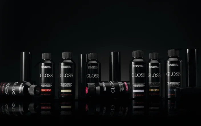 KEVIN.MURPHY+GLOSS product range displayed against a black background featuring acidic demi-permanent gloss shades.