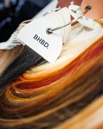 Close-up of BHBD hair extension colour swatches displayed on a salon sample ring.