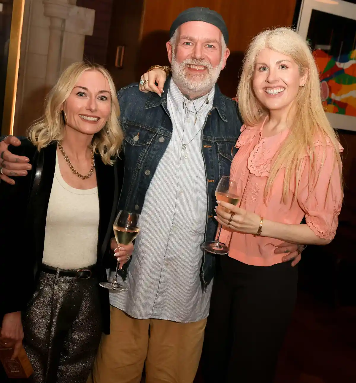 Carrie Tyler, Adam Reed, and Laura Hinton smile for a photo at the MC Awards.