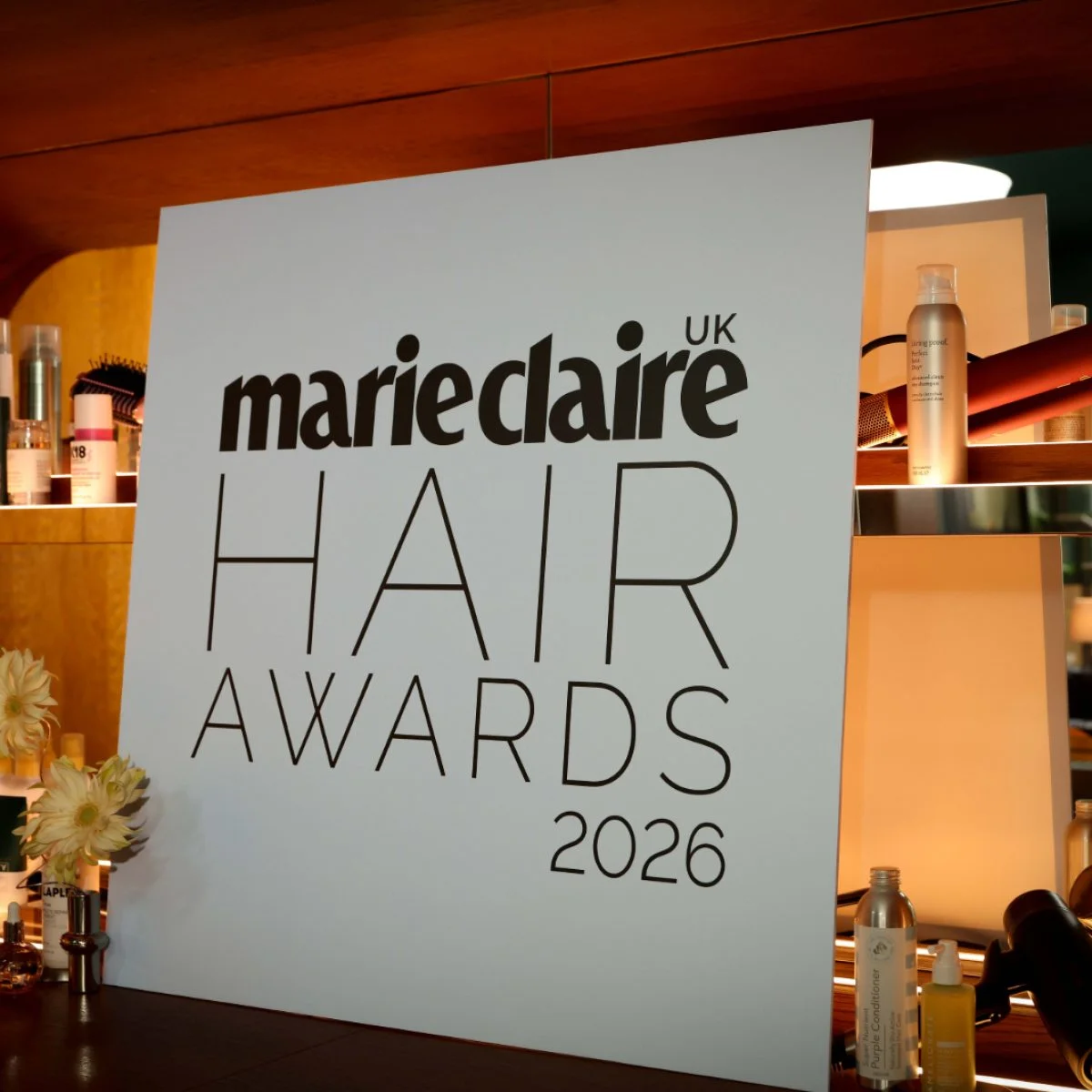 A black and white Marie Claire Hair Awards 2026 sign stands on a bar.