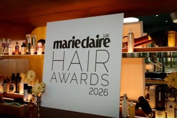 A black and white Marie Claire Hair Awards 2026 sign stands on a bar.
