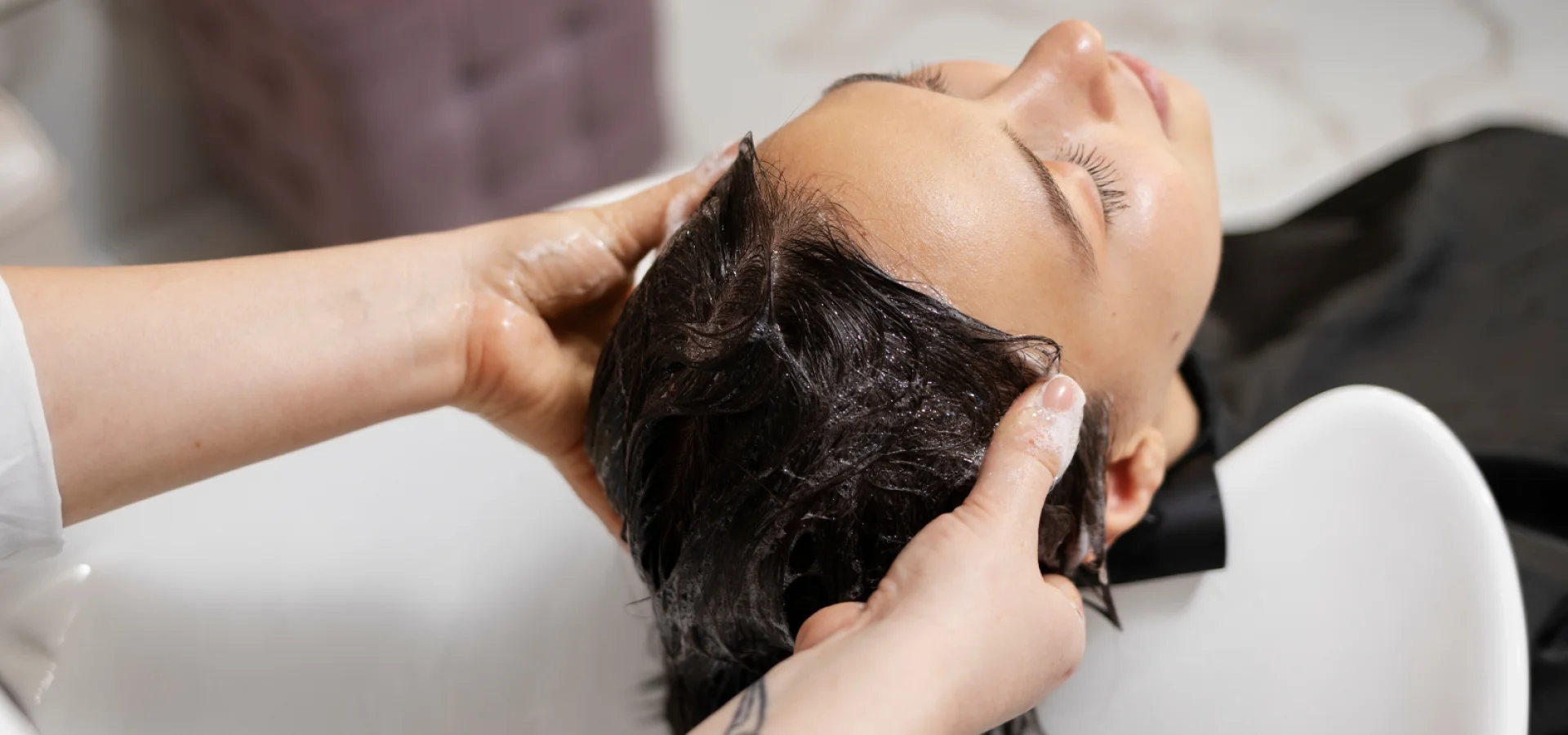 Hairdresser gives a scalp service at Paul Mitchell's Head Spa.