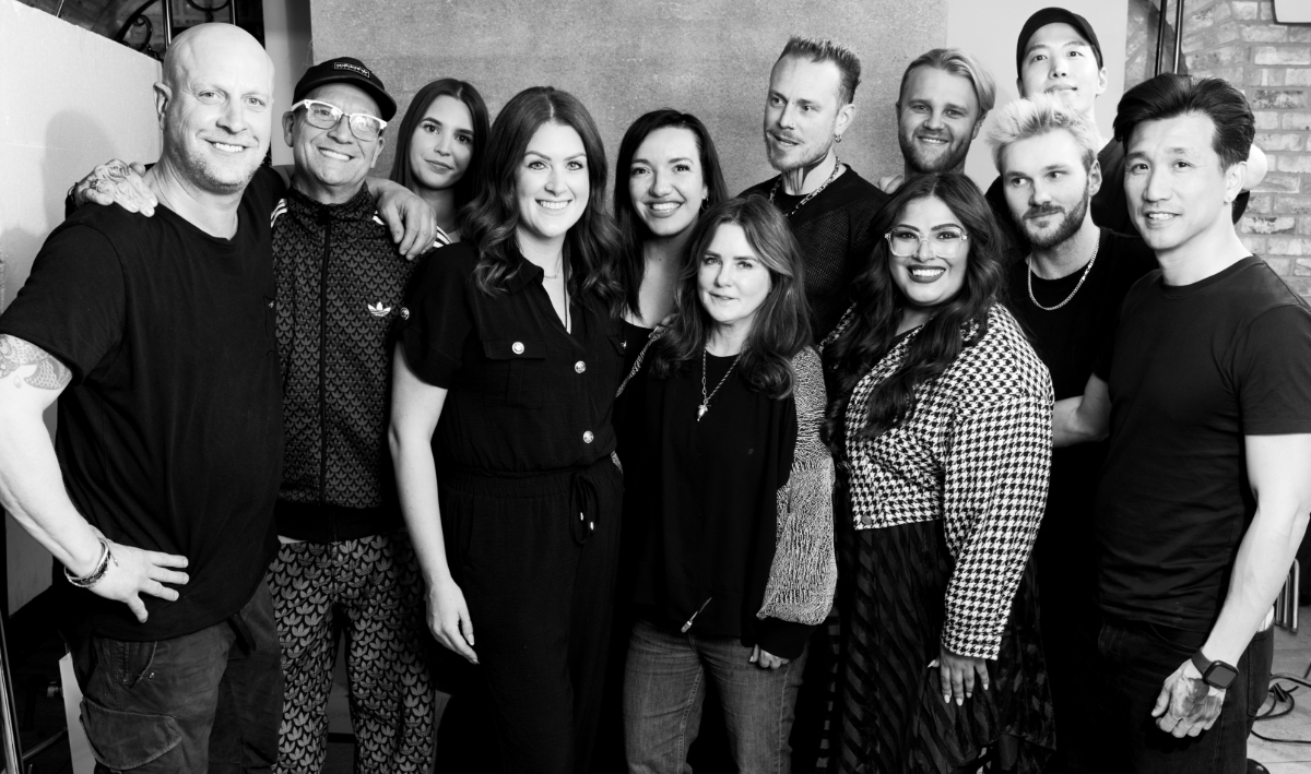 RUSH New Art Team group portrait featuring leading hairdressers, educators and creatives driving innovation in professional hairdressing.