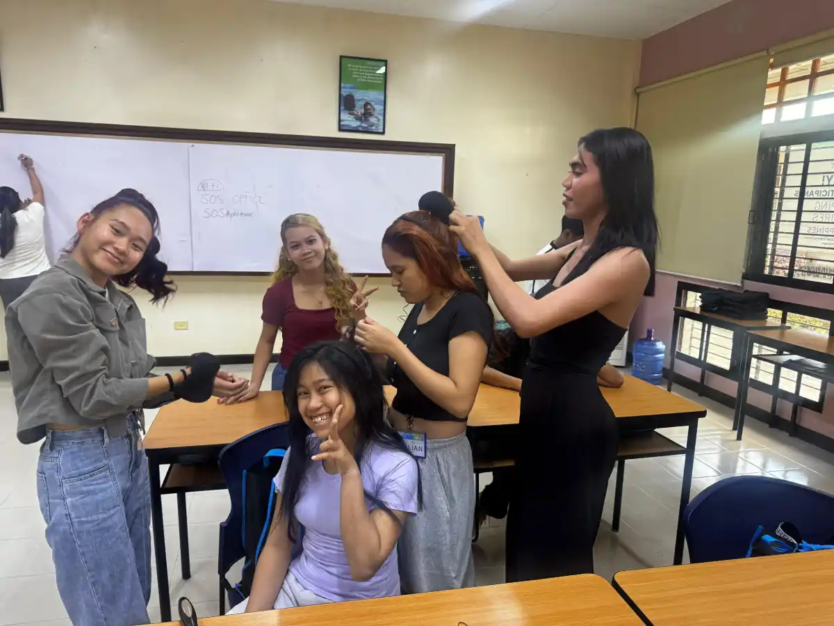 Students participate in Schwarzkopf Professional's Shaping Futures Philippines classroom programme, developing practical hairdressing skills.