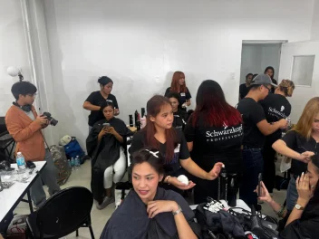 Schwarzkopf Professional Shaping Futures Philippines programme, with educators and students gaining hands-on hairdressing training backstage.