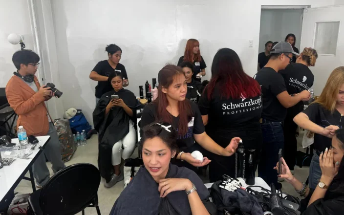 Schwarzkopf Professional Shaping Futures Philippines programme, with educators and students gaining hands-on hairdressing training backstage.