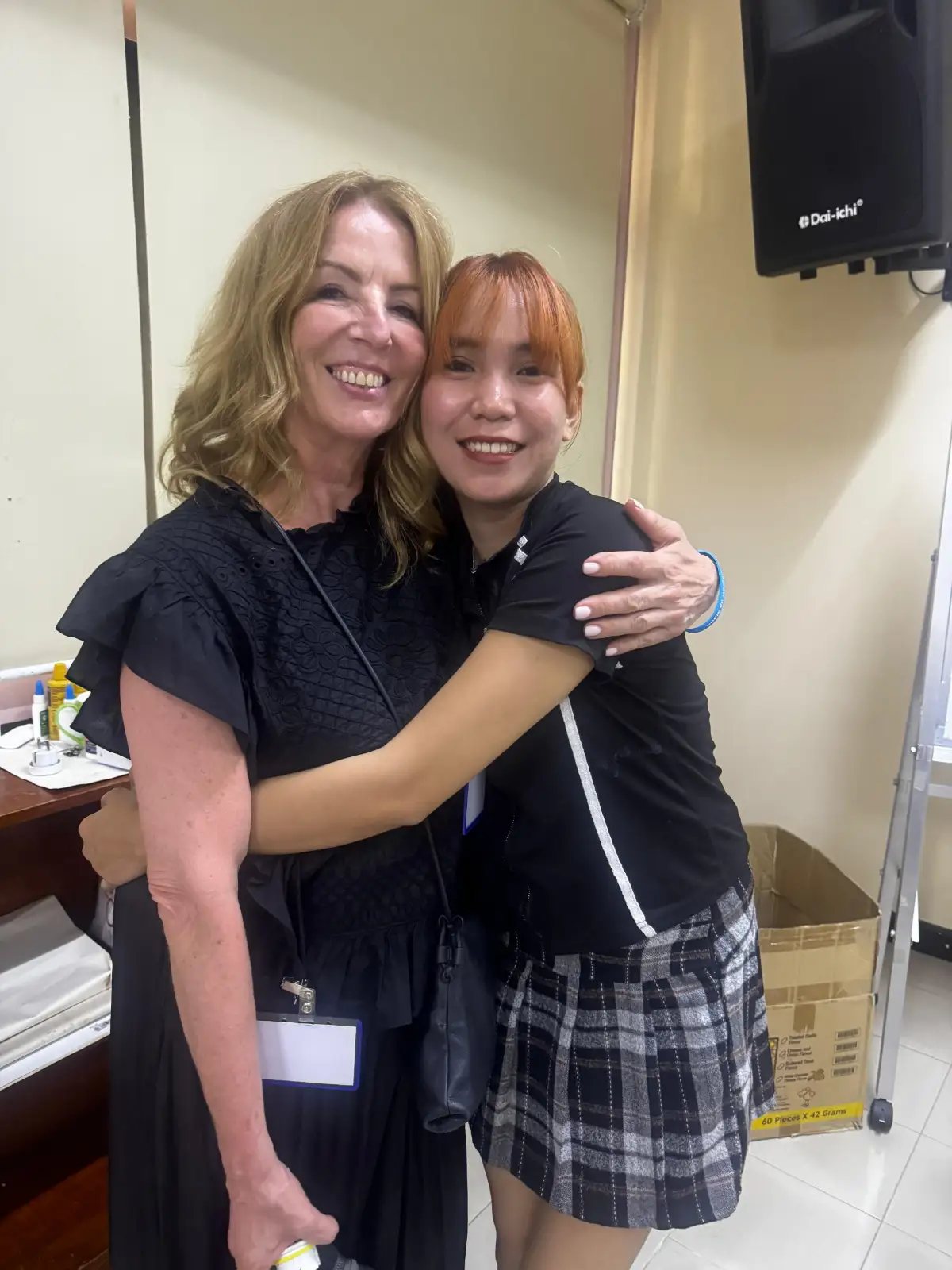 Schwarzkopf Professional Ambassador Suzie McGill with a Shaping Futures student in the Philippines, celebrating hairdressing education and opportunity.