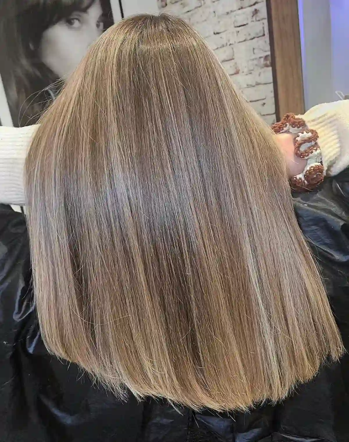 Glossy old money blonde with soft beige tones and sleek precision cut for a healthy, luxury blonde hair finish.