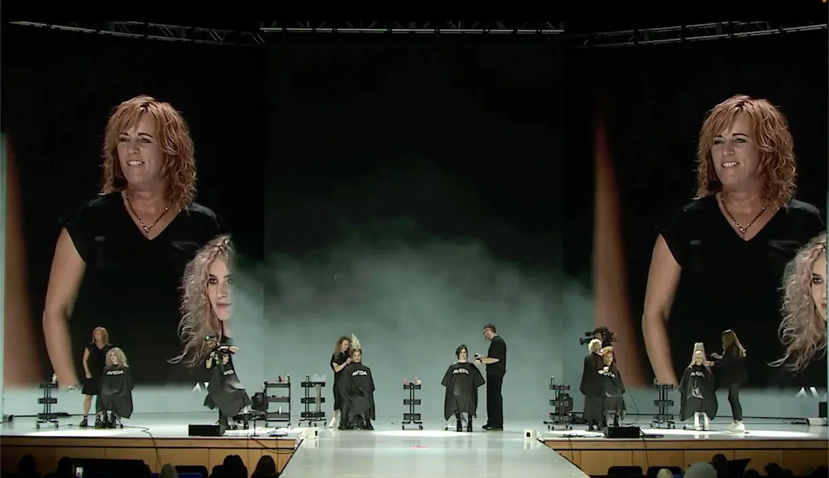 Aveda Artistic Team on the stage at a smoke filled event.