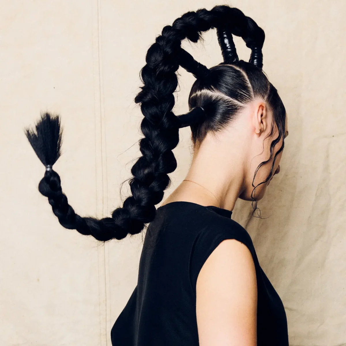 Project Scotland 2026 avant-garde braided hairstyle with sculptural looped plaits and precision sectioning.