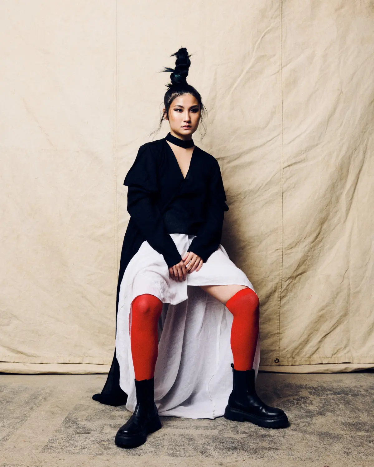 Project Scotland 2026 editorial hairstyle featuring a sculptural topknot and avant-garde fashion styling.