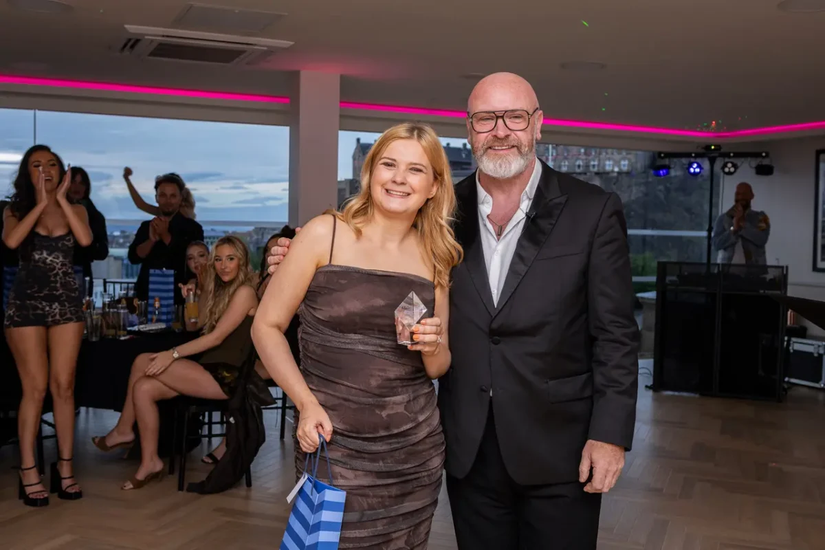 Managing Director Colin McAndrew smiles for the camera with the team at the Medusa awards.