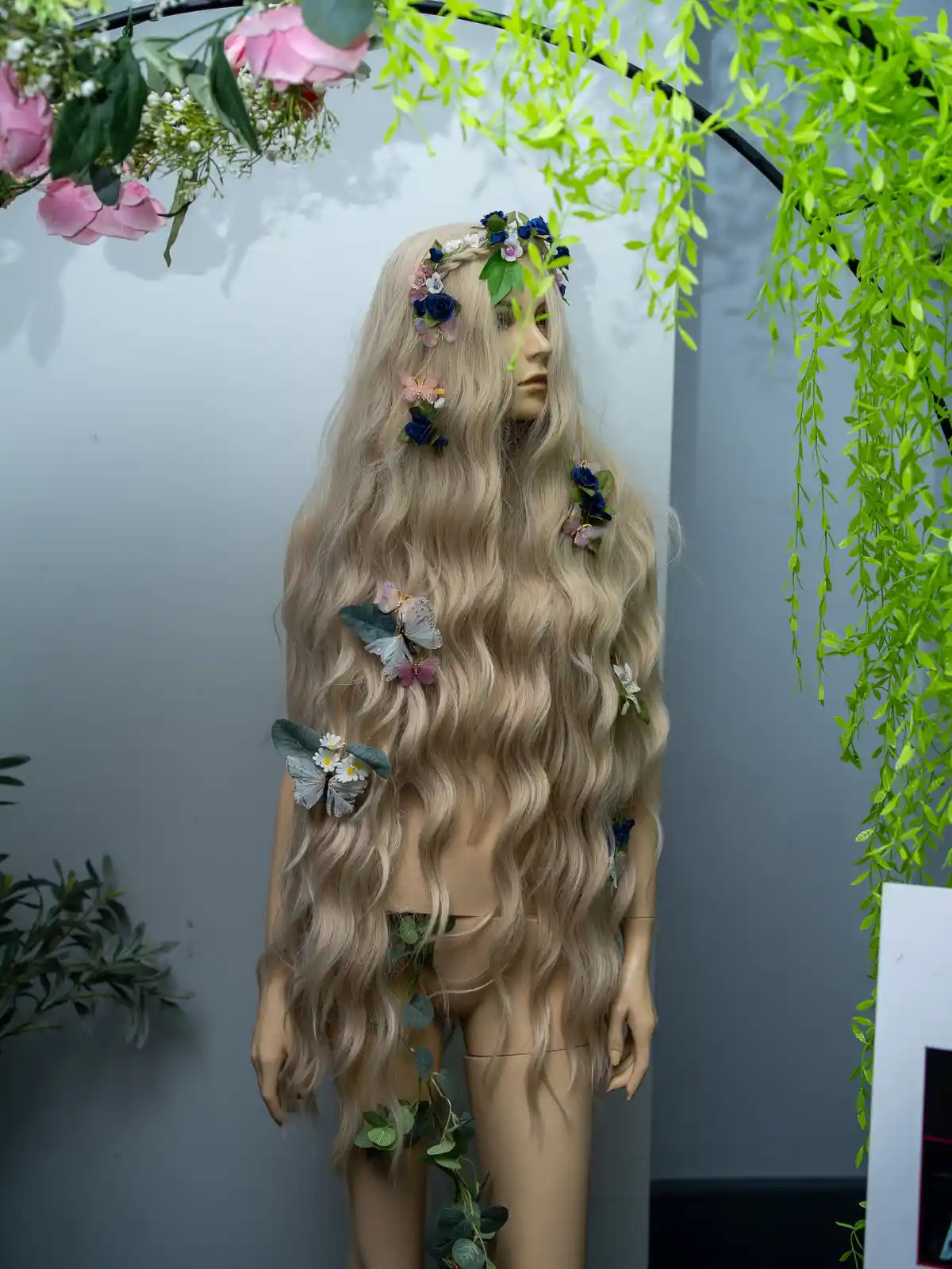 Mannequin covered by long flowing blond hair at Never Just Hair exhibition.