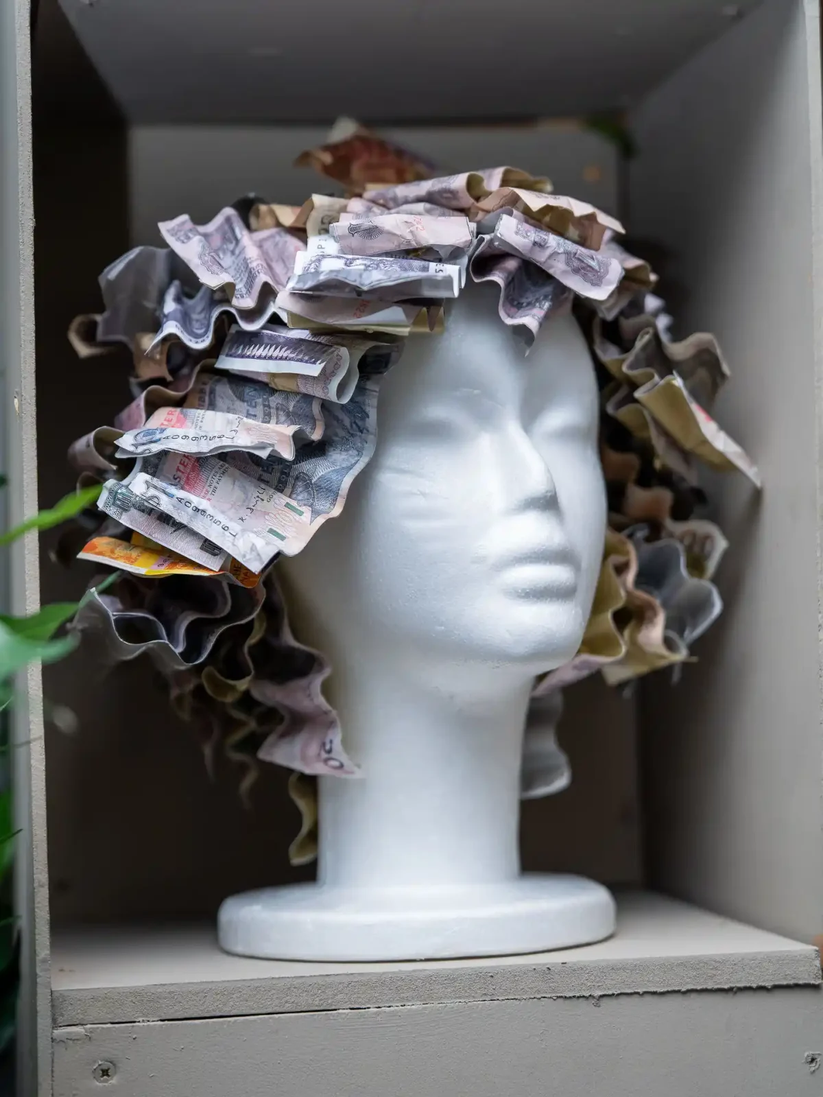 Mannequin head with creative hair on display at Never Just Hair exhibition.