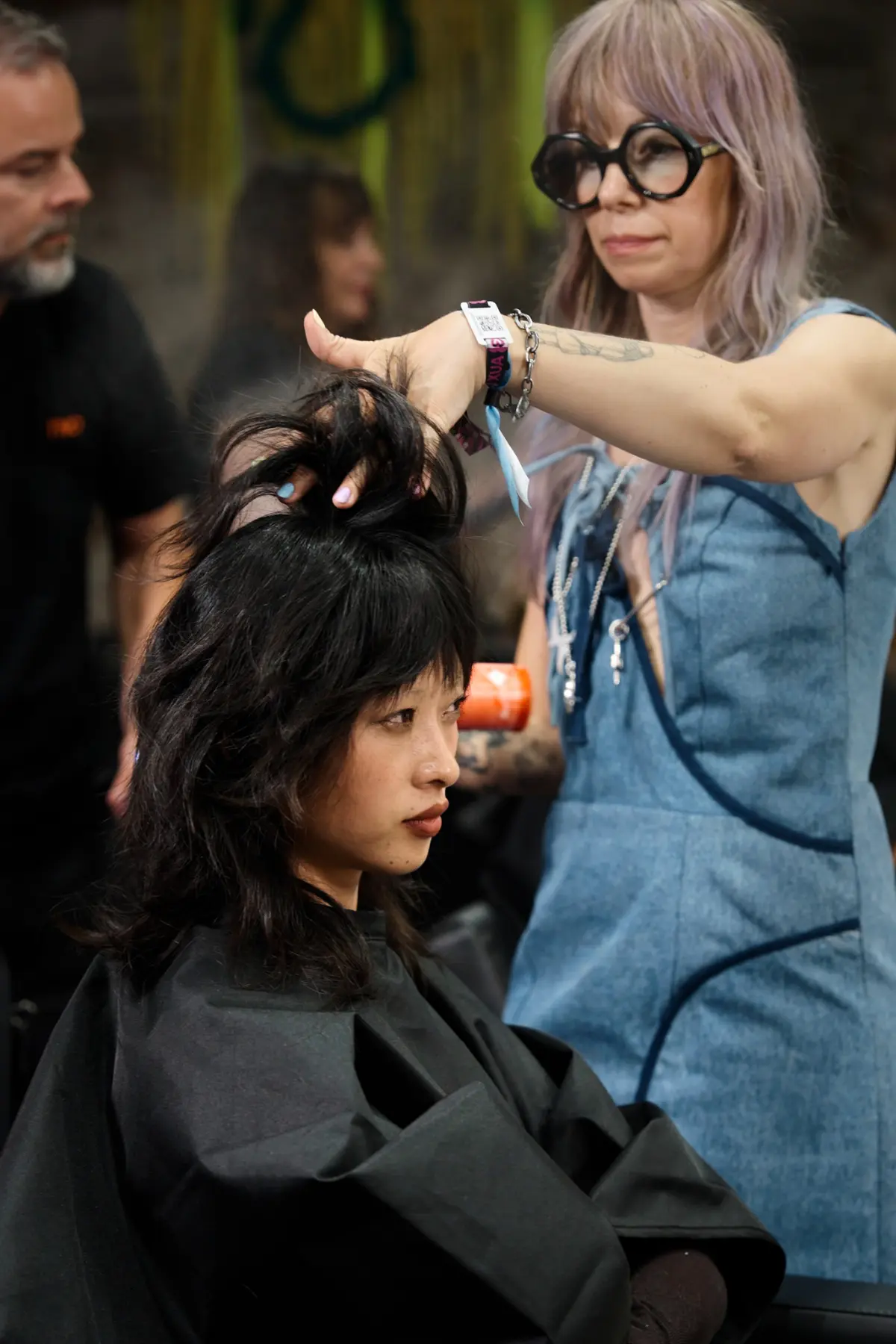 Hairdresser styles a model backstage at SKP X Primavera Sound.