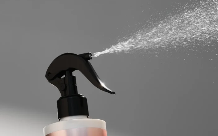 JOICO Dream Blowout Glass frizz-fighting spray bottle with fine mist, designed for smooth, glossy blow-dry results.