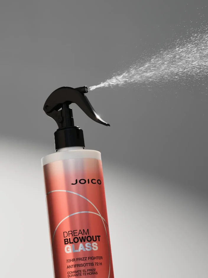 JOICO Dream Blowout Glass frizz-fighting spray bottle with fine mist, designed for smooth, glossy blow-dry results.