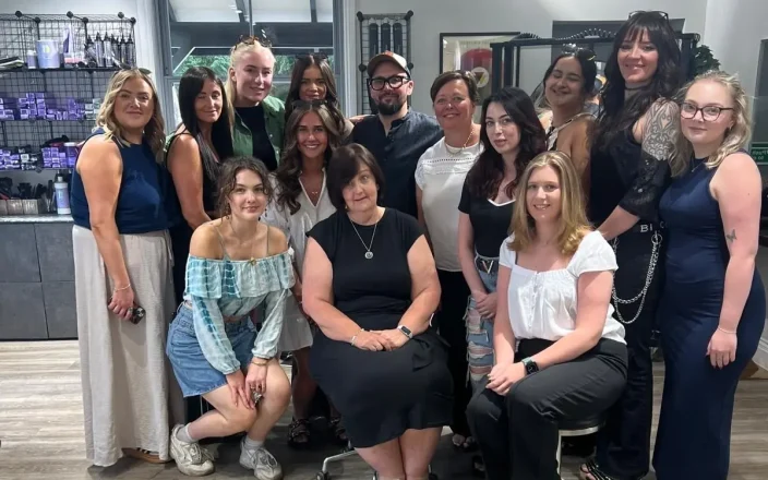 Hairdressing team poses for a photo at a re:new education event.