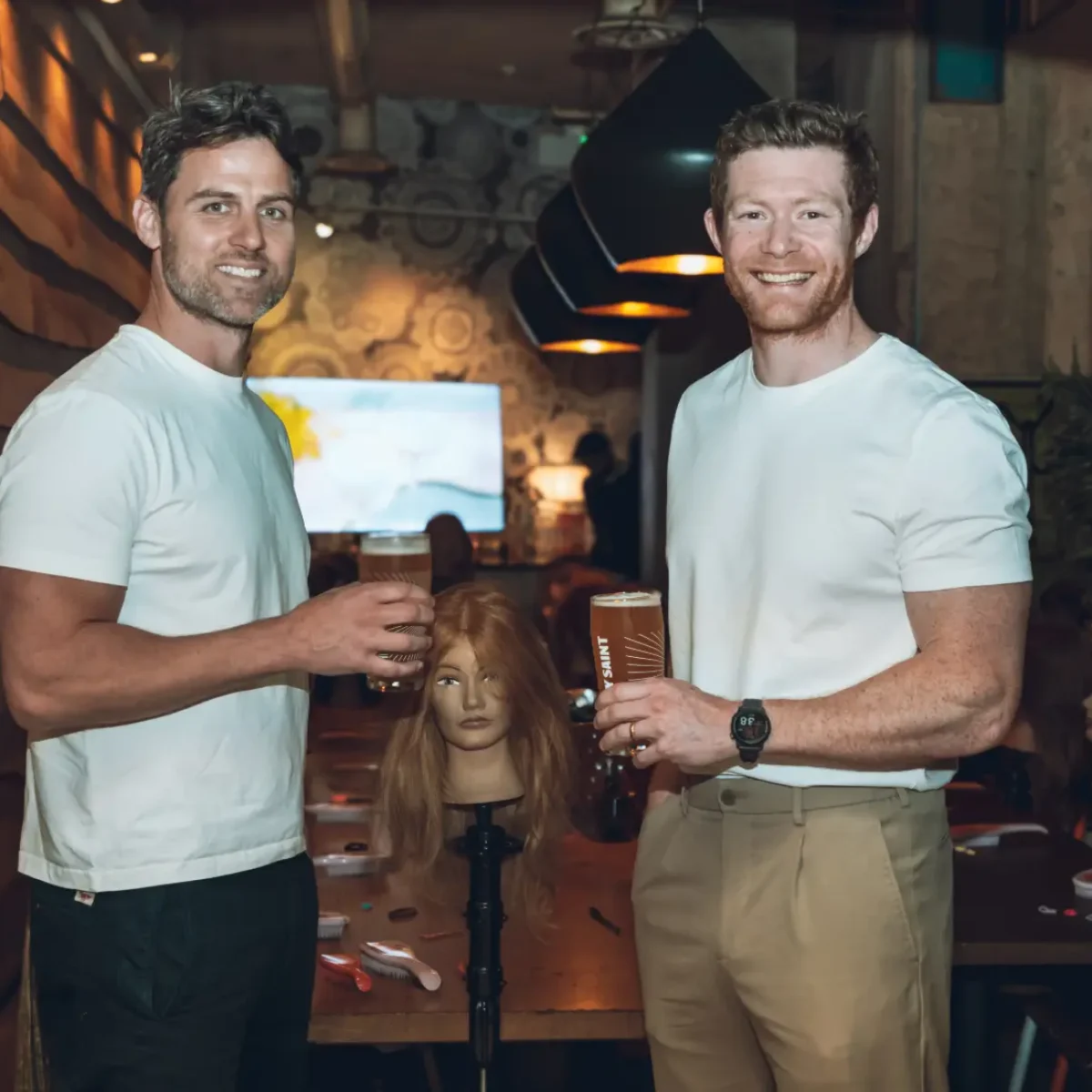 Dad’s Mathew Carter and Lawrence Price drink a pint at an event by The Secret Life of Dads podcast.