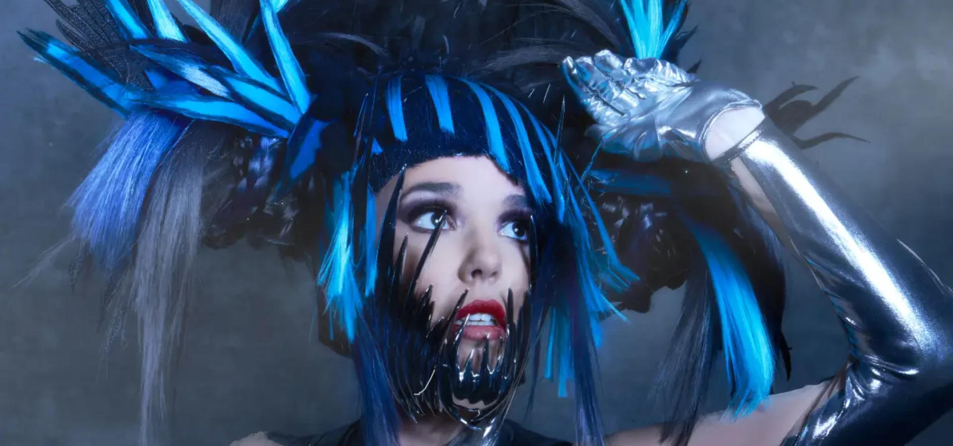 Model with blue and black headdress from from the collection 'ANGELS’ by William and Norma Gray.