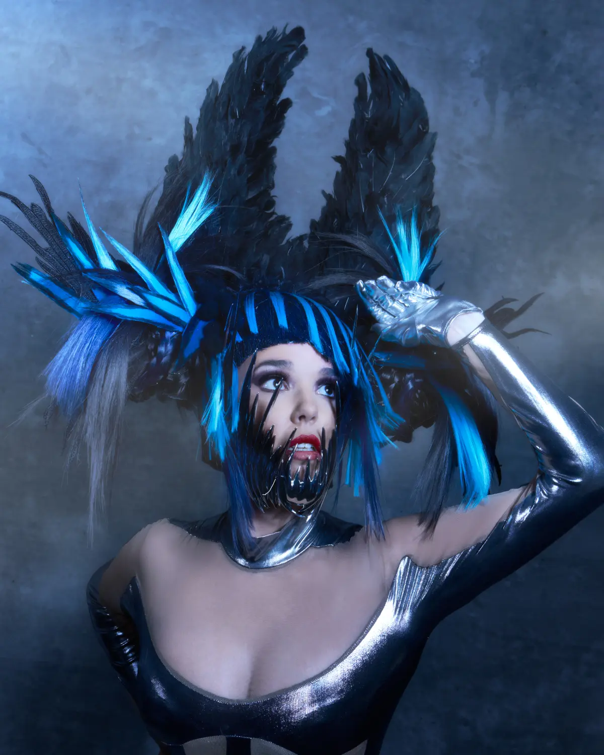 Model with blue and black headdress from from the collection 'ANGELS’ by William and Norma Gray.