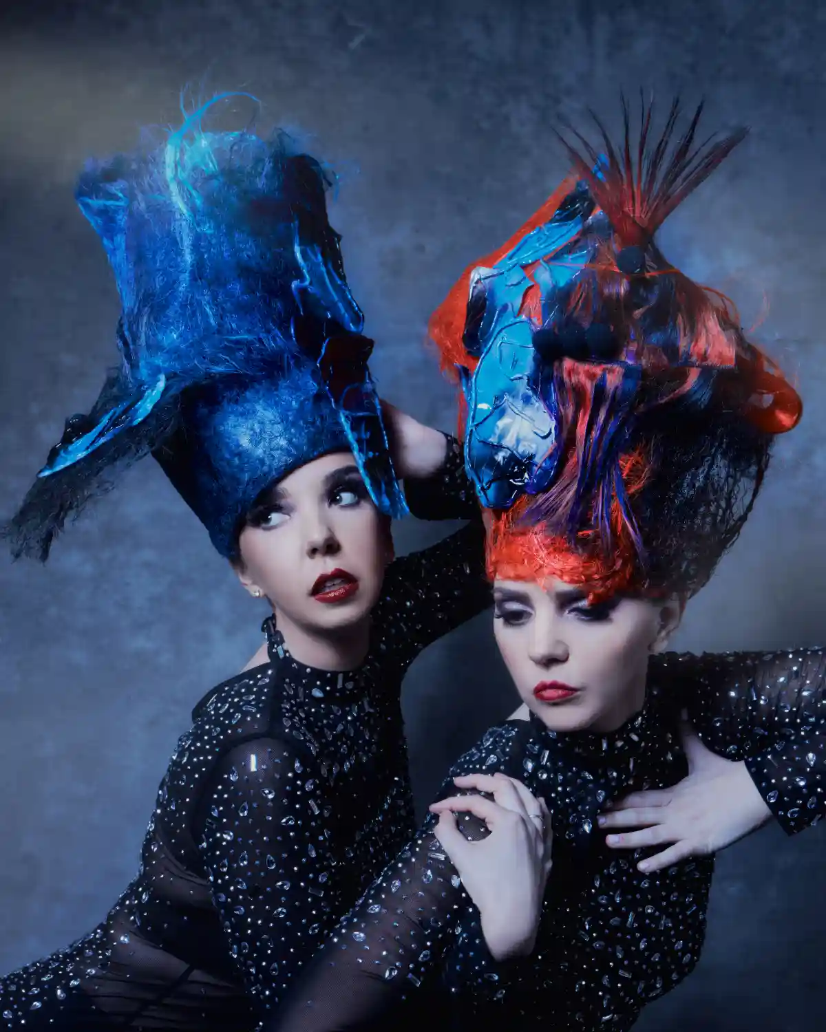 Two models with colourful headdresses from the collection 'ANGELS’ by William and Norma Gray.