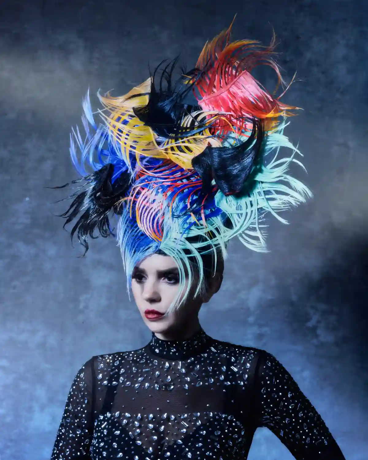 Model with colourful feathery headdress from the collection 'ANGELS’ by William and Norma Gray.