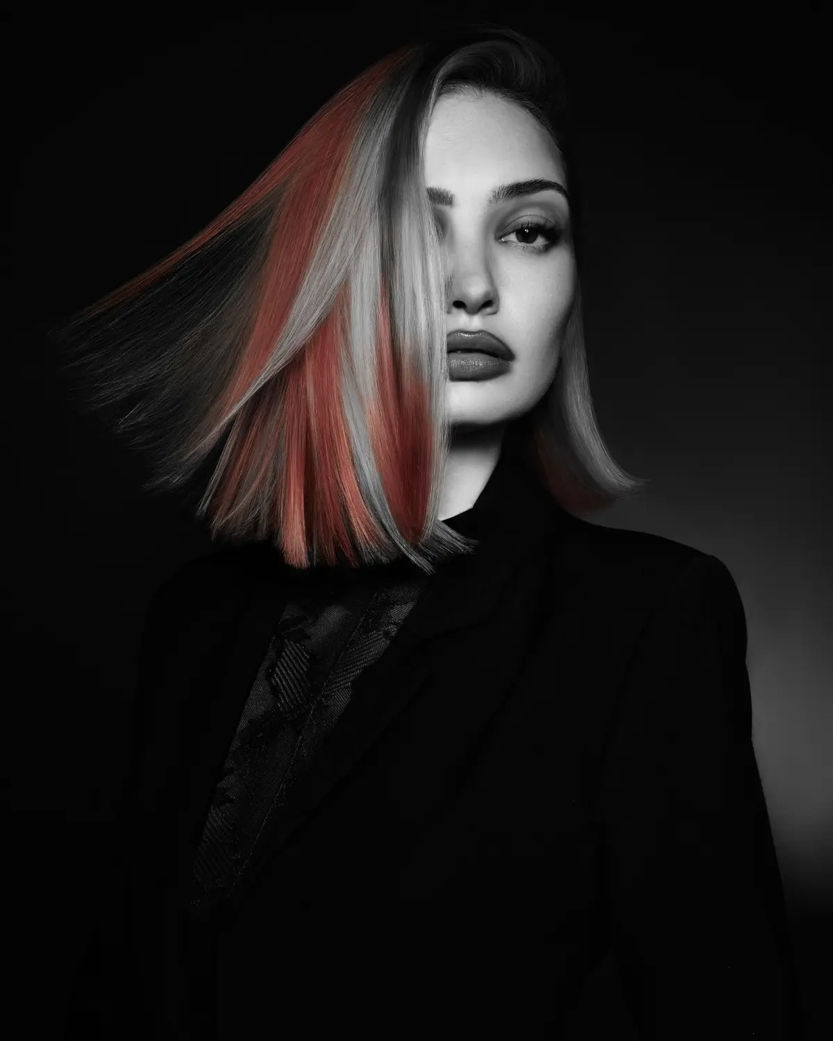 Sleek shoulder-length bob with contrasting red and silver panels from Niall McNulty's Accent Collection, celebrating shape and simplicity.