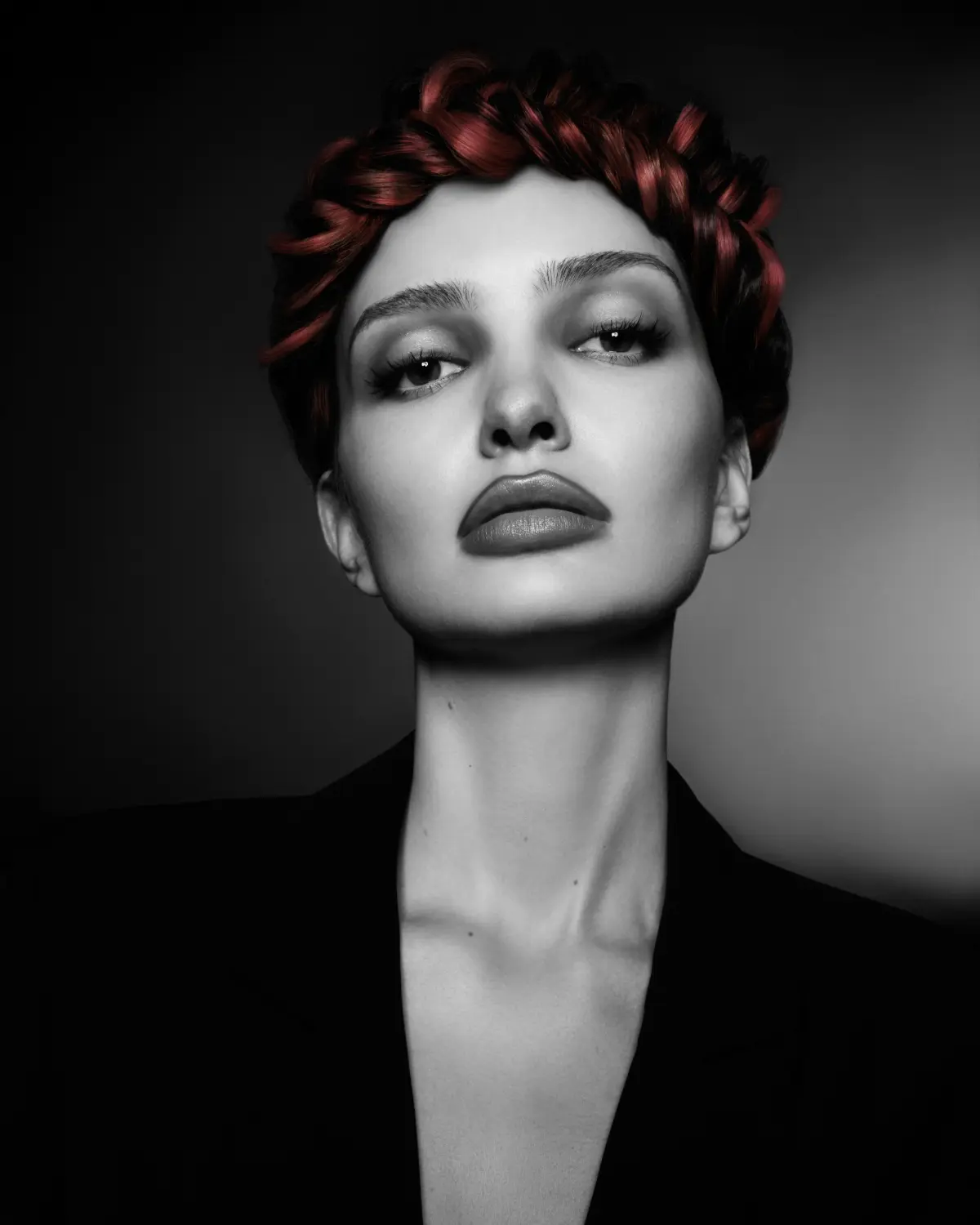 Braided red-brown updo with sculptural texture from Niall McNulty's Accent Collection, celebrating shape, contrast and simplicity.