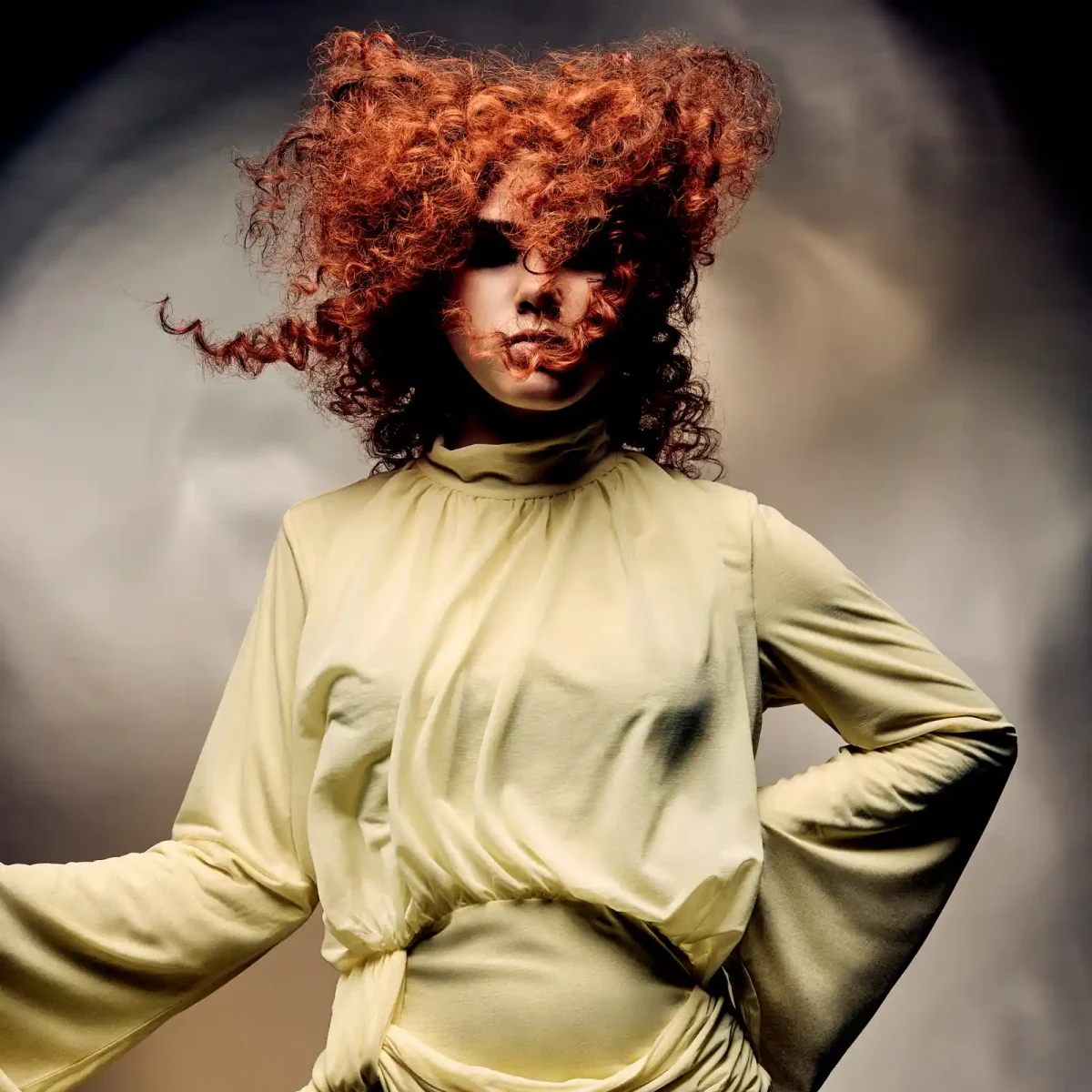 Alex Thaddeus Tempest Collection featuring voluminous copper curls styled to capture movement through the atmosphere.