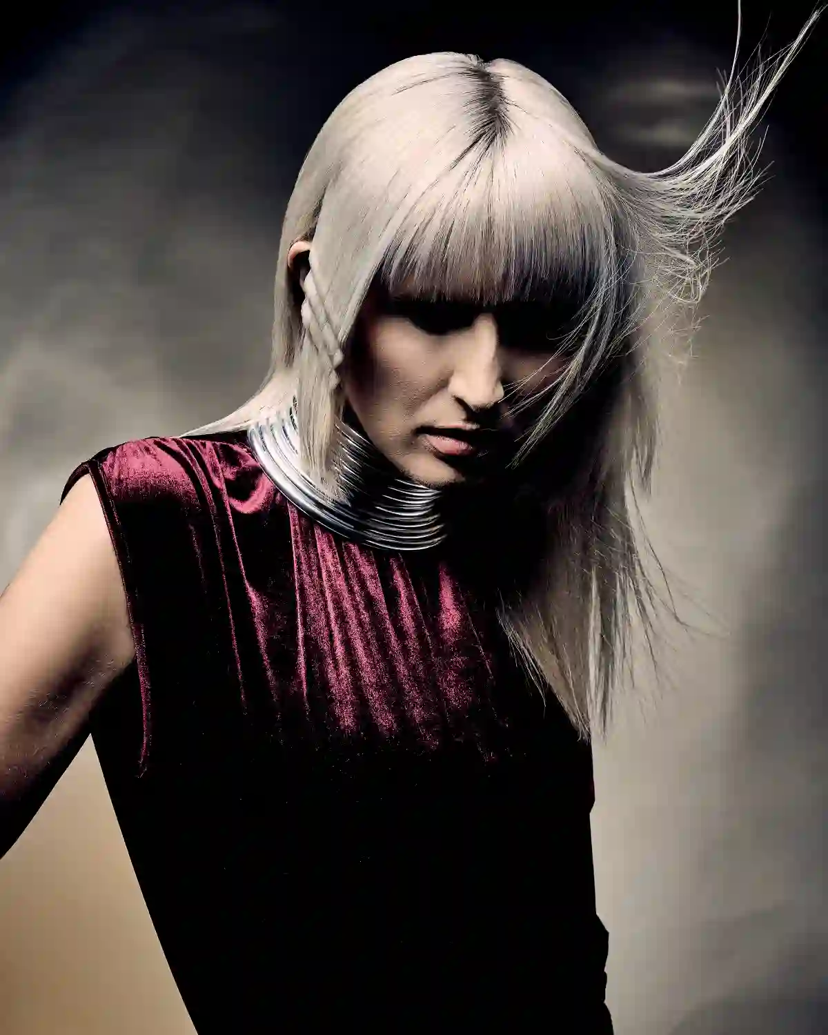 Tempest Collection by Alex Thaddeus featuring a sleek blonde bob with blunt fringe, styled to capture movement through the atmosphere.
