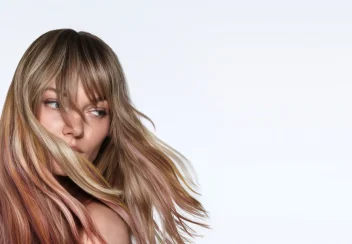 Model with long blonde and pink hair highlighting the Color Muse Keune collection.
