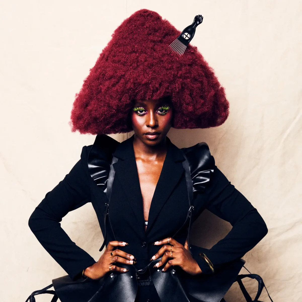 Model with sculptural burgundy Afro hairstyle from Project Afro 2026's The Crown: A Journey Through Texture collection.