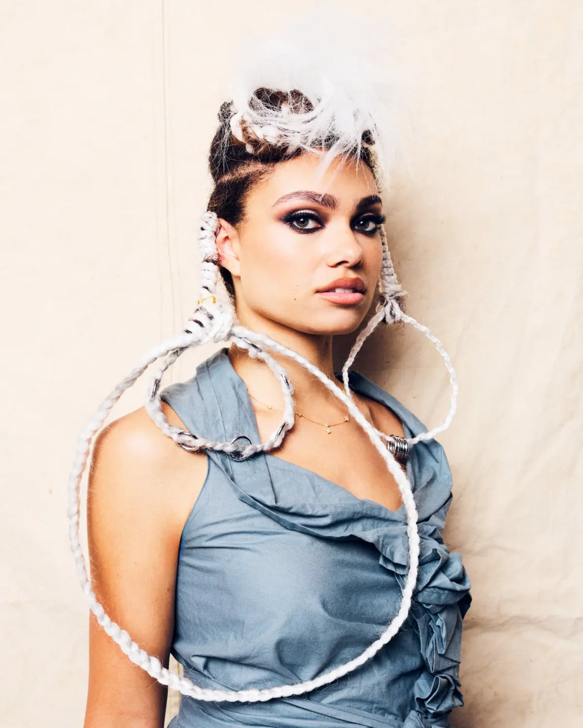 Model with sculptural white braided hairstyle from Project Afro 2026's The Crown: A Journey Through Texture collection.