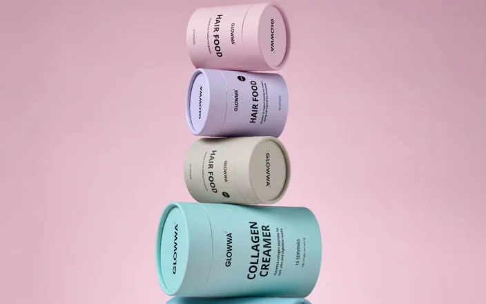 All of Glowwa's products stacked together on a pink background.