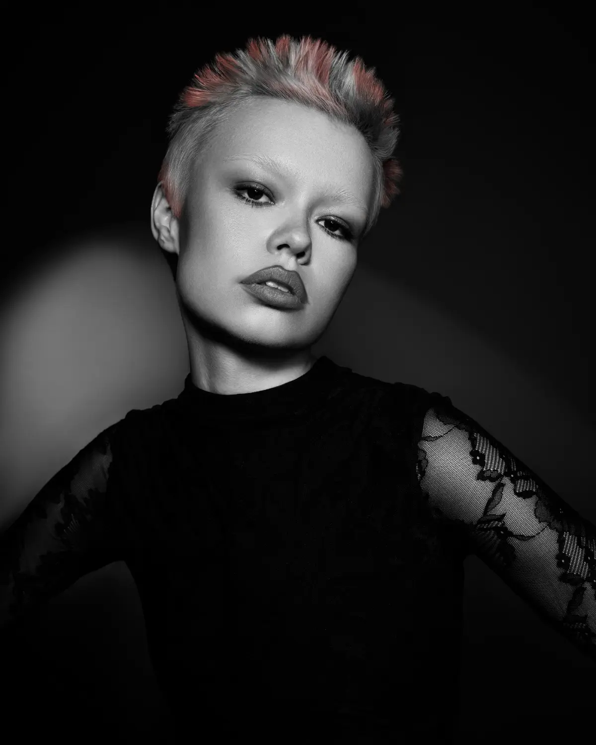 Short textured pixie cut with pink accents from Niall McNulty's Accent Collection, celebrating shape, contrast and simplicity.