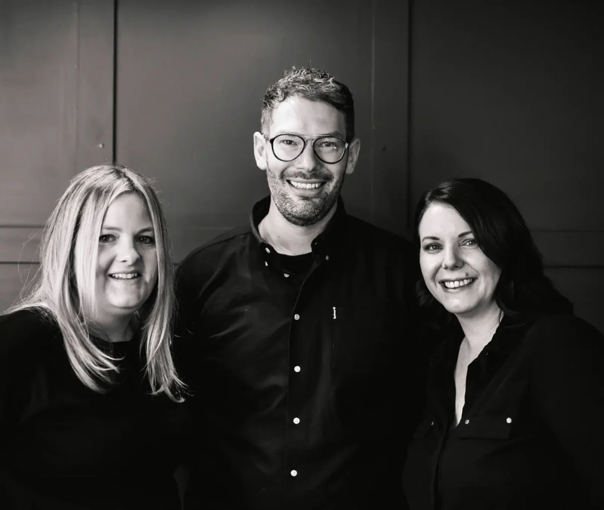 The team at Pare Hair co stand together for a photo.