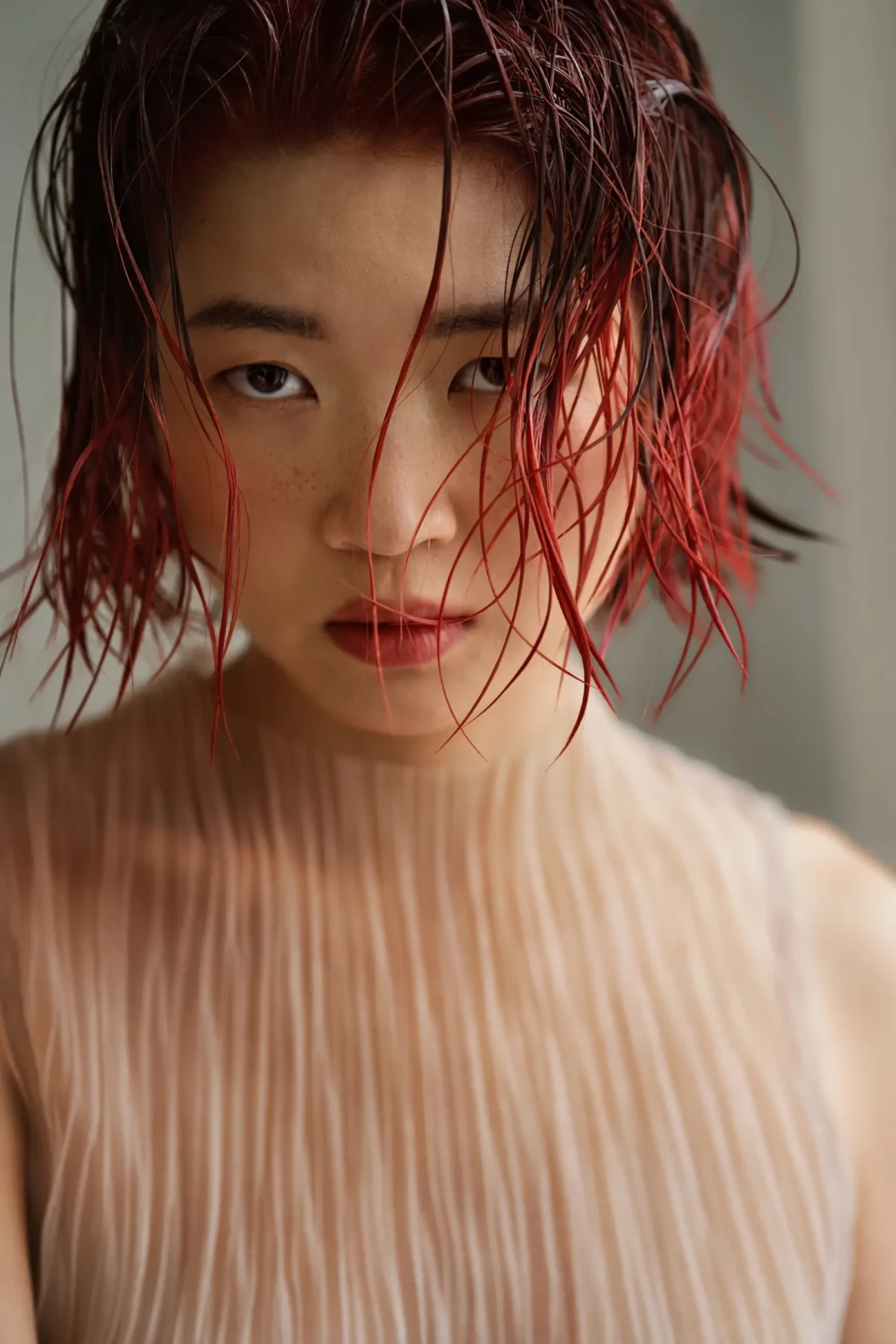 Model with wet-look auburn bob from Tracey Ann Smith's AW26 salon trend predictions for MOOD Hair Colour.