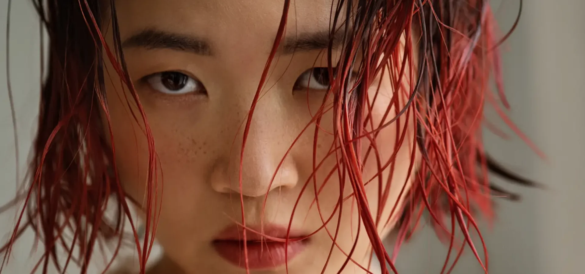 Model with wet-look auburn bob from Tracey Ann Smith's AW26 salon trend predictions for MOOD Hair Colour.