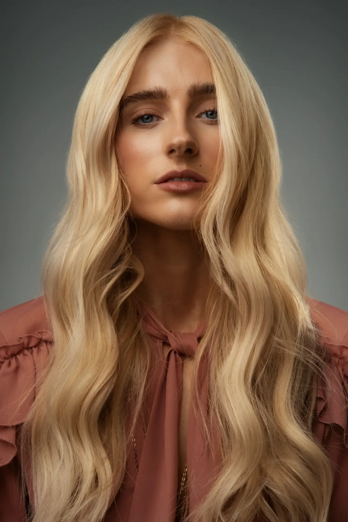 Model with long Bessette Blonde waves from Tracey Ann Smith's AW26 salon trend predictions for MOOD Hair Colour.