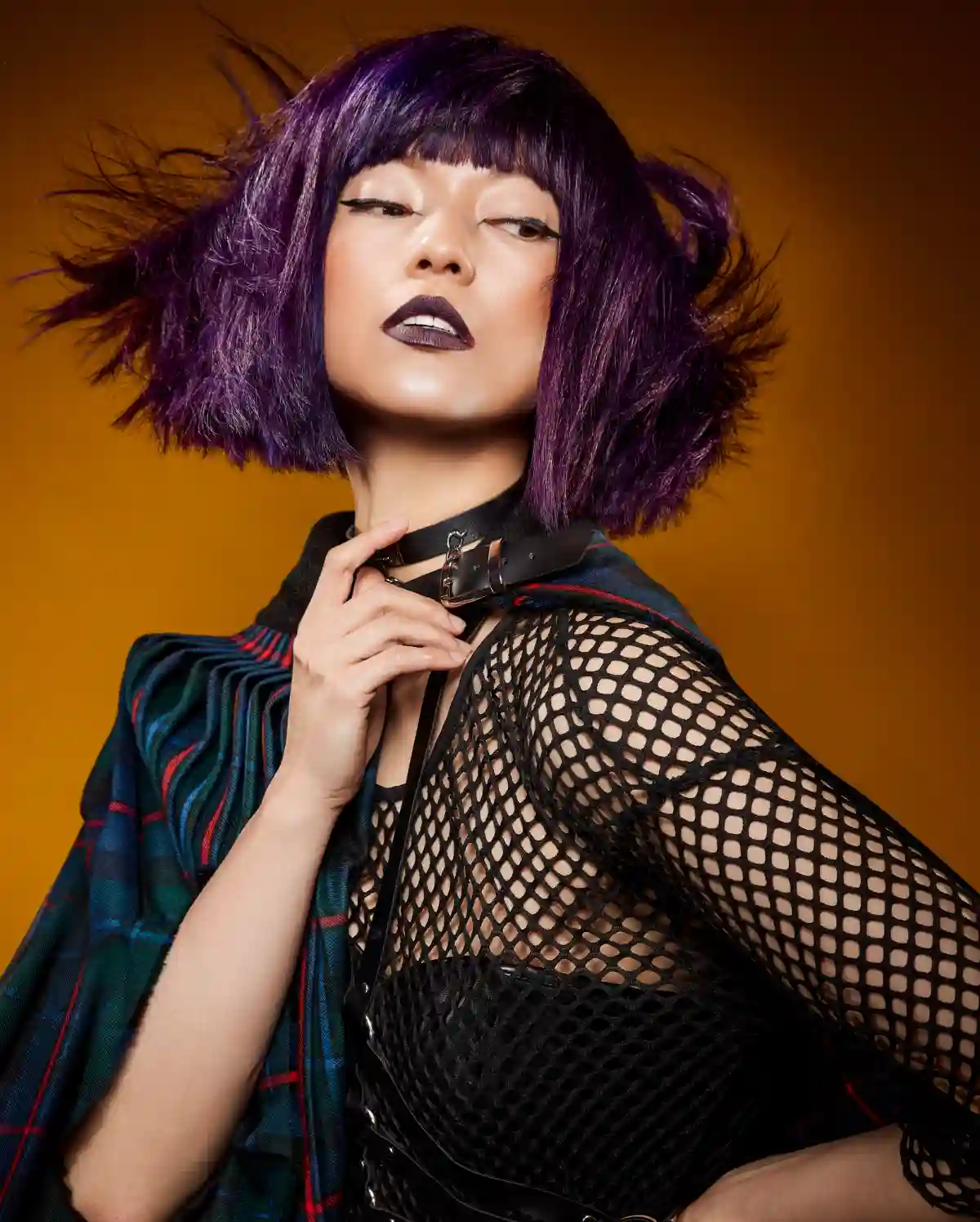 A model with deep plum hair as dark, dimensional colour takes centre stage for autumn/winter.