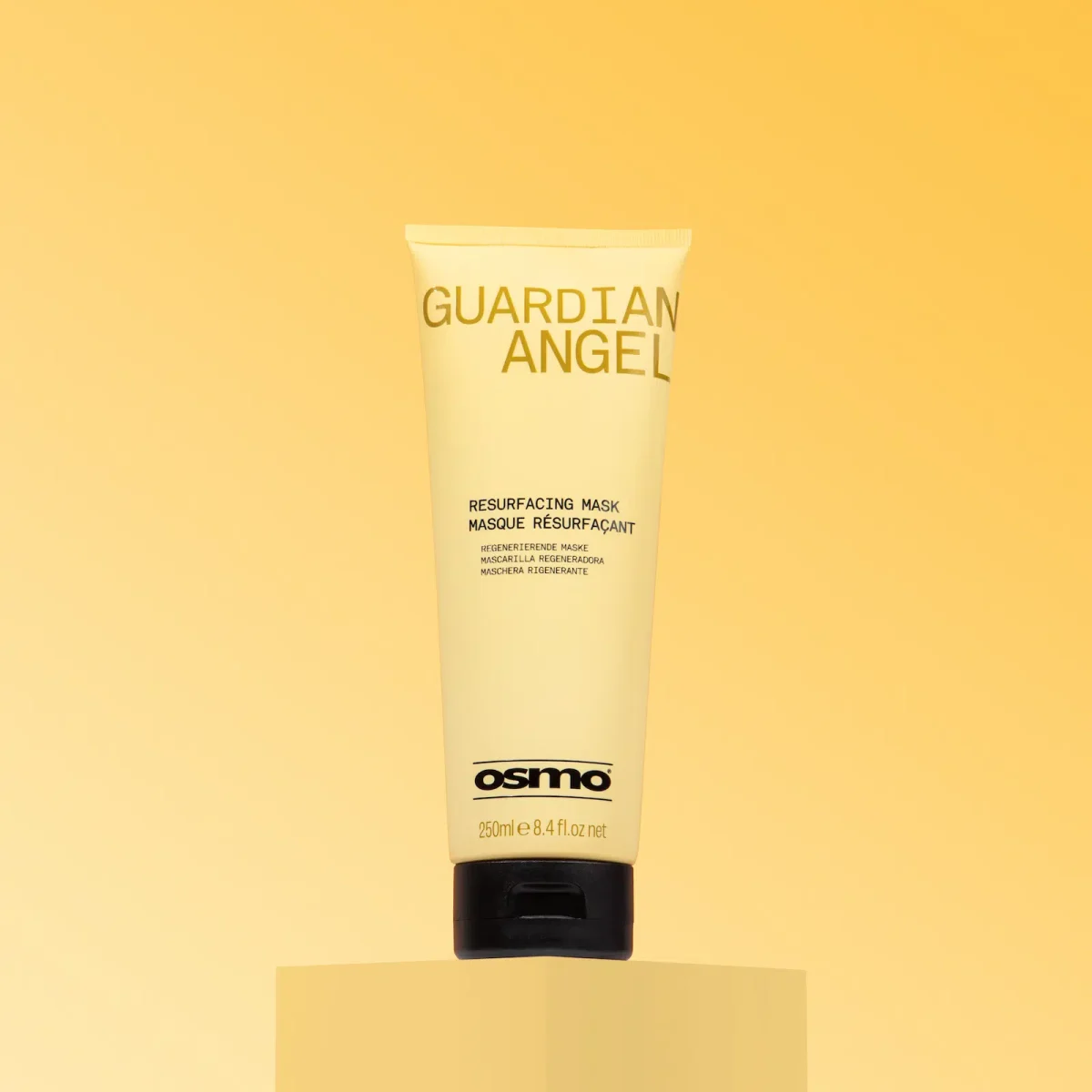 A bottle of OSMO Guardian Angel Hair Mask in branded packaging on a yellow backdrop.