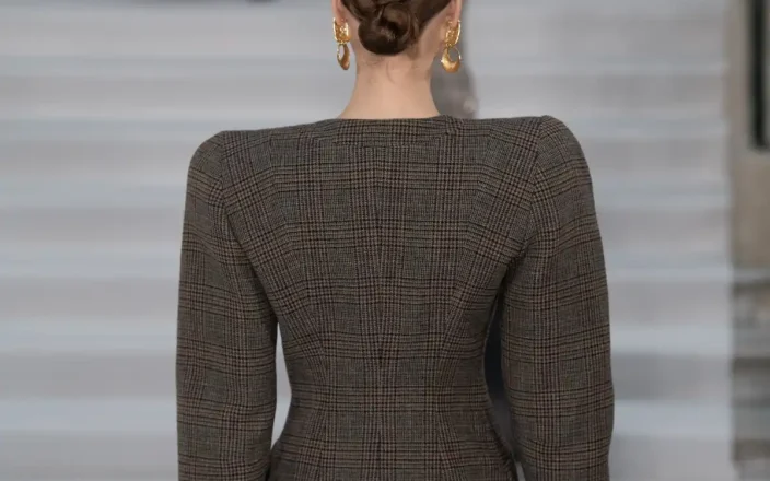Behind a model with brown hair at Paul Costelloe AW26.