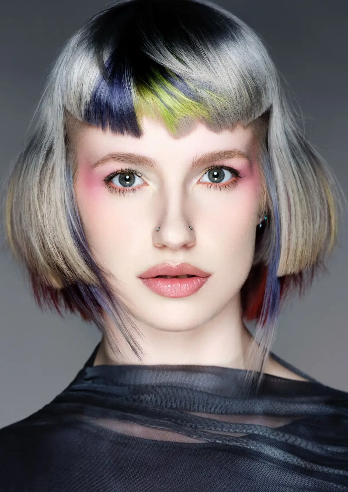 Textured silver airy bob with graphic fringe and bold colour accents from Roar Hair & Beauty's AW26 hair trend predictions.