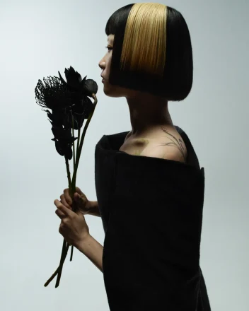 Model with blunt bob hair exploring refined simplistic beauty with the Eclipse collection by Marlon Hawkins.