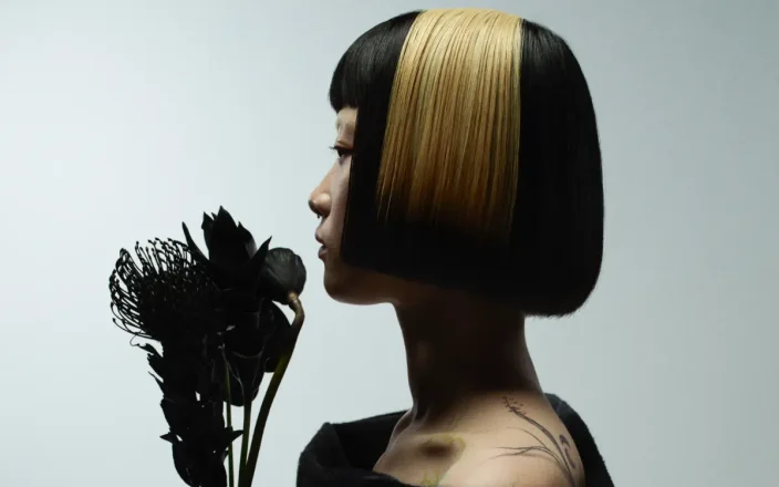 Model with blunt bob hair exploring refined simplistic beauty with the Eclipse collection by Marlon Hawkins.