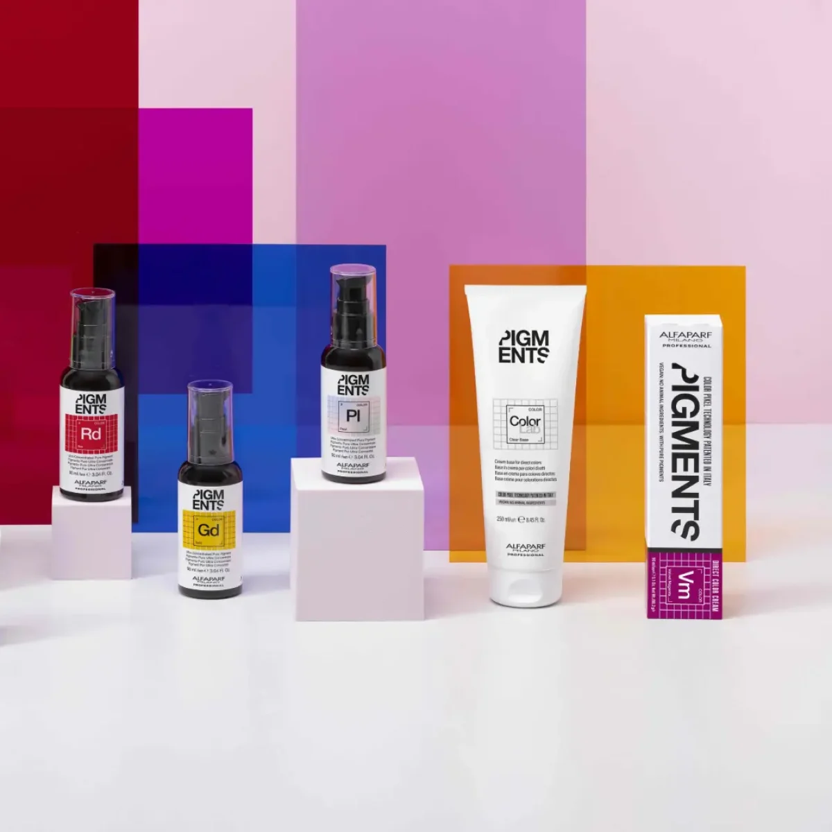 ALFAPARF Milano Professional's PIGMENTS Direct Colour System products on a colourful background.